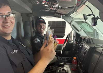 Premier Ambulance EMS workers enjoying snacks inside their ambulance.