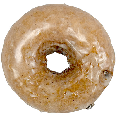 Circular doughnut with small flecks of blueberry and a thin transparent glaze.
