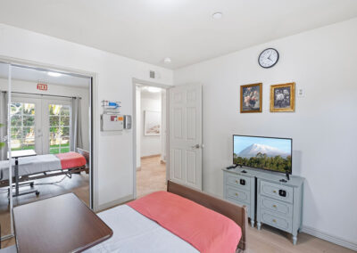 A bedroom with a TV at Newport Heights