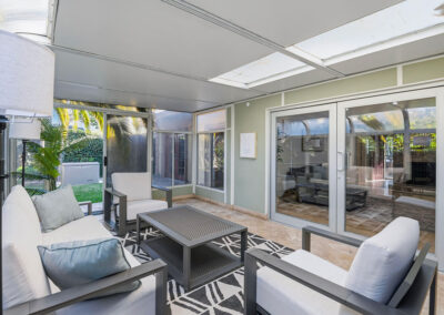 A covered patio with couches at Newport Heights