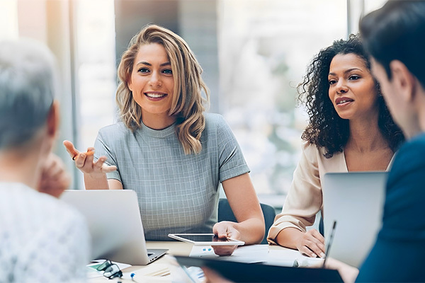 Group holding a meeting inside an office