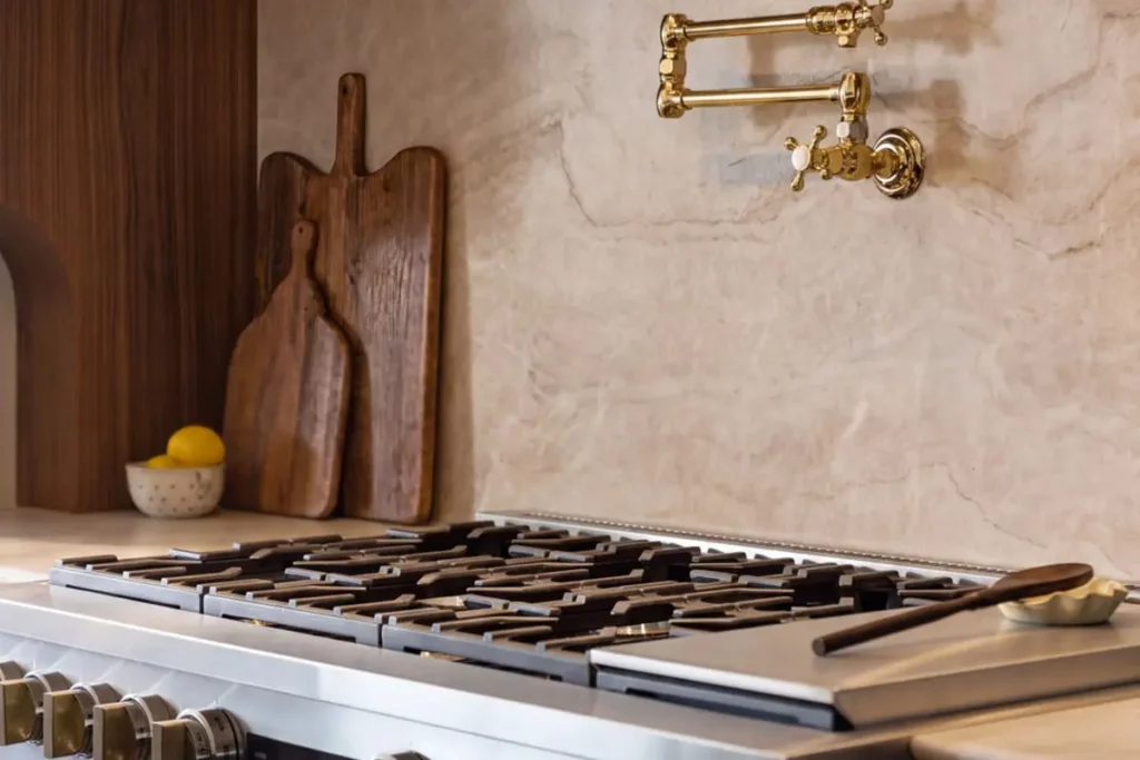 Granite countertops with wooden cutting boards and a brand new stovetop