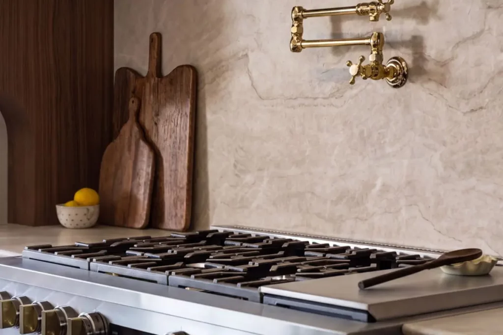 Granite countertops with wooden cutting boards and a brand new stovetop