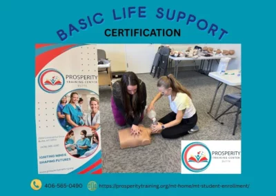 Performing a CPR demonstration at the Group picture with seven graduates at the Prosperity Training Center