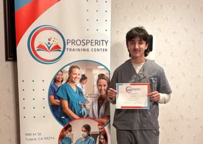 A nurse with his certificate of graduation at Prosperity