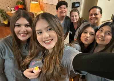 A group of Prosperity graduates taking a selfie