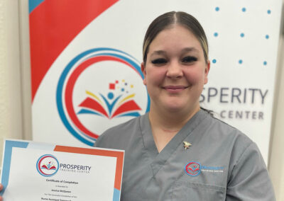 A nurse with her certificate of graduation at Prosperity