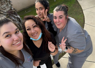 Four Prosperity graduates taking a selfie