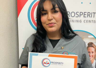 A nurse with her certificate of graduation at Prosperity