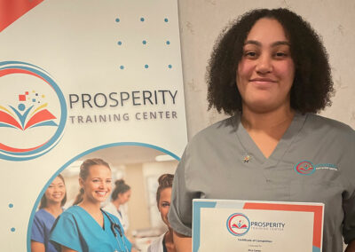 A nurse with her certificate of graduation at Prosperity