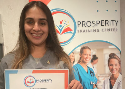 A nurse with her certificate of graduation at Prosperity