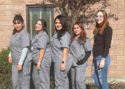 Five Prosperity graduates standing together