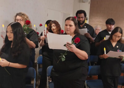 A group of Prosperity graduates reading their certificates