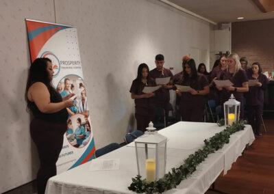 A group of Prosperity graduates with their certificates at the event