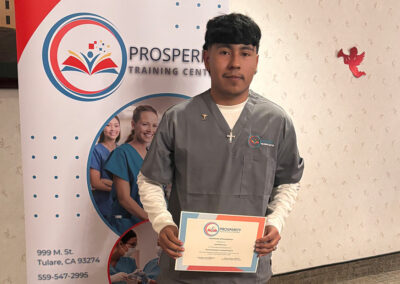 A nurse with her certificate of graduation at Prosperity